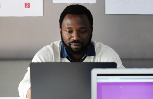 Adult student working on a laptop