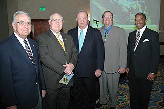 President Floyd standing next to award winners