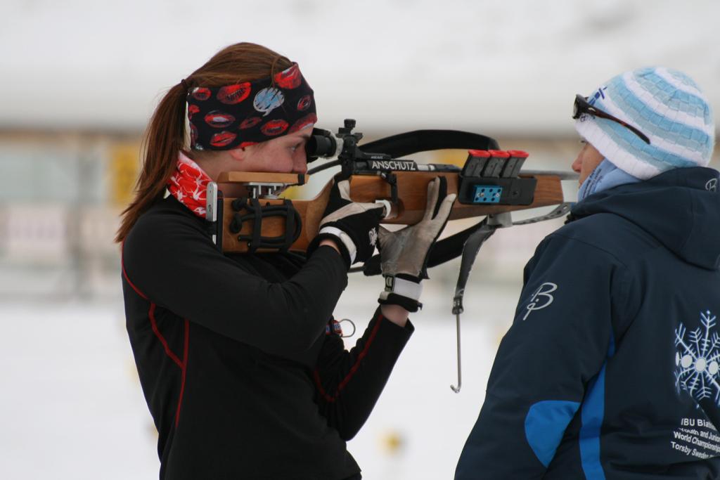 Natasha focuses her sight during the shooting portion of a biathlon.