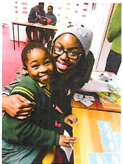 A teaching posing with a student