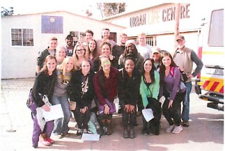 A group of students posing next to the Urban Life Centre