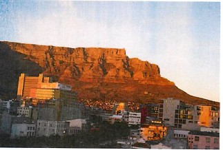 A photo of Cape with mountainside in background