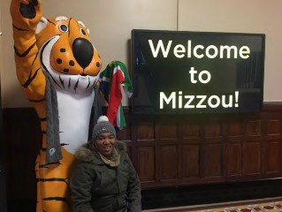 Truman the Tiger next to Johan Fourie