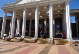 A photo of a large building with columns