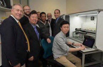 UMSAEP Director Rod Uphoff, UM System President Mun Choi and UWC Rector Tyrone Pretorius meet with researchers.