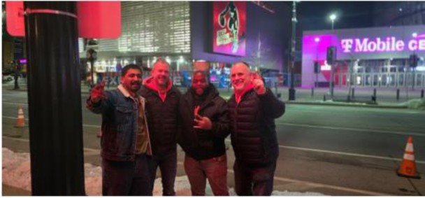 George, Makhaya, Brendon and Cody in front of the football stadium.