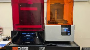 Two 3d printers that are used for the dental images