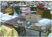 A table loaded with boxes and other supplies