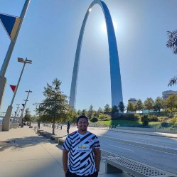 Standing under The Gateway Arch in St. Louis, MO.