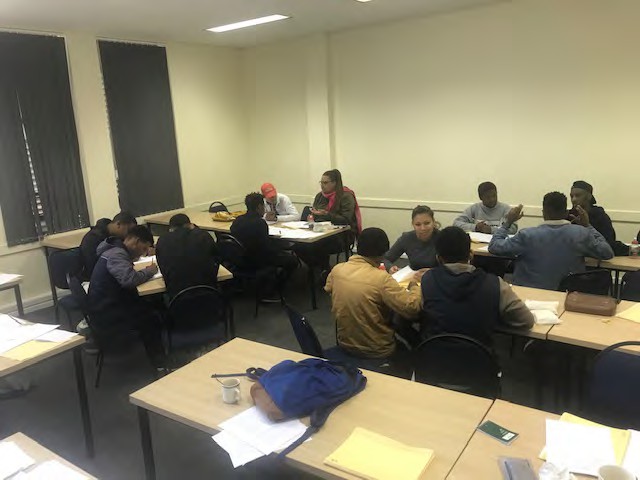 A photo of the students working in groups