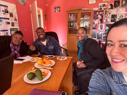 Fikile, Scotti, Limpho, and Astrid talking about the history and past leadership of the GEU<