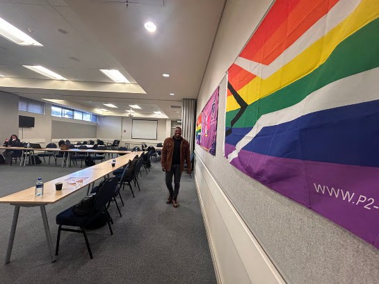 Scotti helping with set up for a educational training given by GEU members.