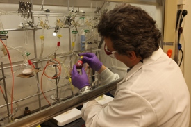 Photo of scientist performing research with various fluids