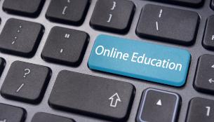 Black keyboard with blue key labeled "Online Education"