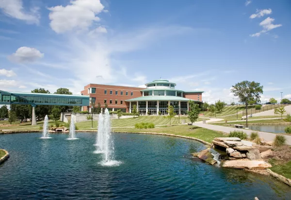 View of UMSL campus, lake and fountains