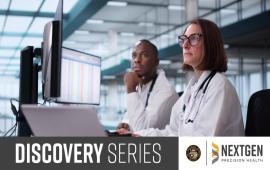 Two white-coat scientists operating a complex system on their desktop