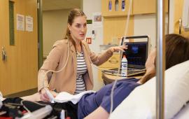 Dr. Natasha Boyes speaks to a study participant in the Clinical Translational Science Unit at the University of Missouri.