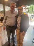 John poses with an interview subject, Mr. Jan Jan Joubert