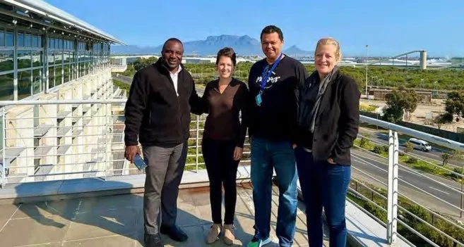 The group poses on a balcony at SANBI