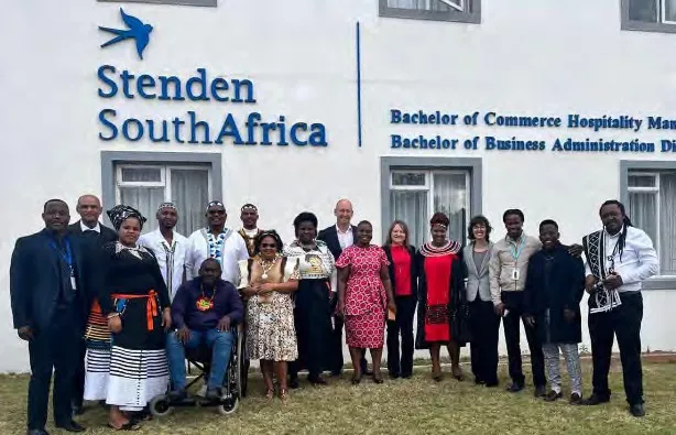 Workshop group poses outside the Stenden South Africa building