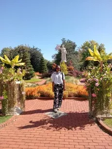 Zolenka poses among plants at the Missouri Botanical Garden 