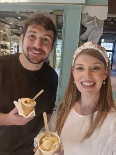 Drinnan and a friend pose holding small ice cream cups