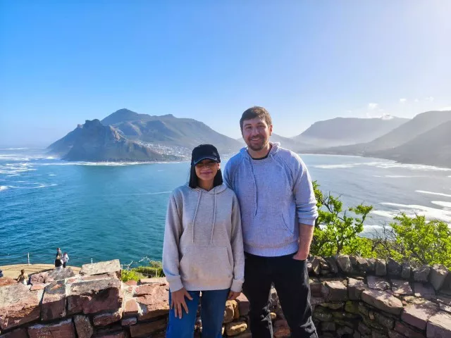 Dr. Roomany and Drinnan pose along the coast