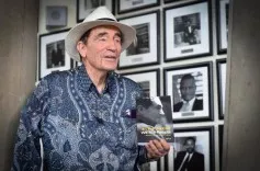 Albie Sachs holding his book