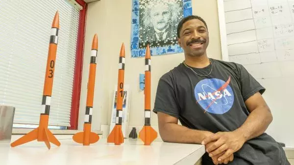 UMSL's Keith Reece with model rockets