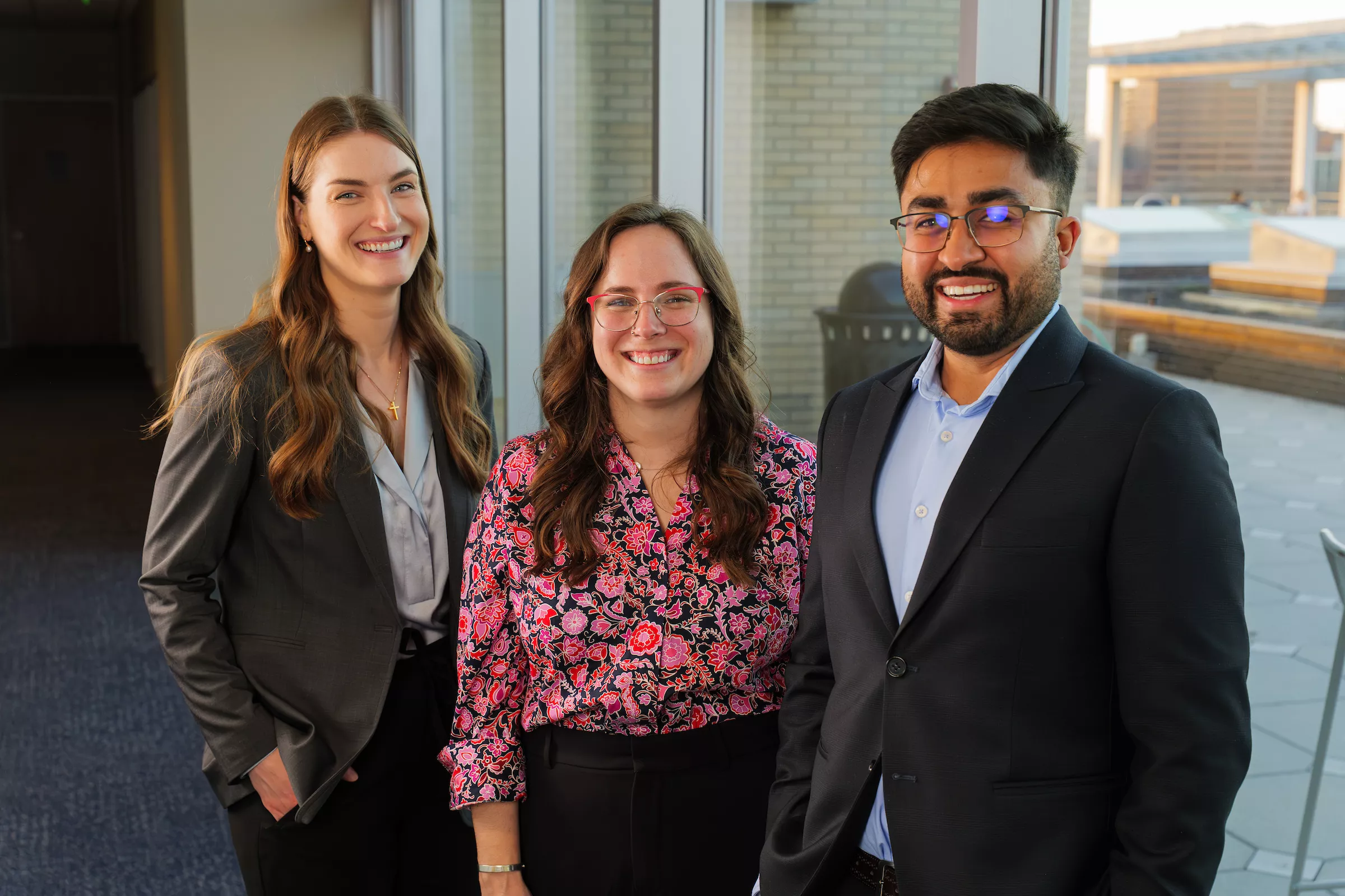 Natasha Boyes, Sandy Saunders and Sunjeev Phull pose together at UMKC's Student Center.