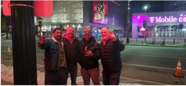 George, Makhaya, Brendon and Cody in front of the football stadium.