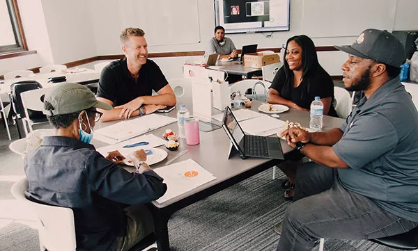  Terrell Jolly, at right, meeting with other entrepreneurs in AltCap’s NeXt Stage KC business development program