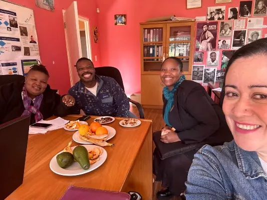 Fikile, Scotti, Limpho, and Astrid talking about the history and past leadership of the GEU<