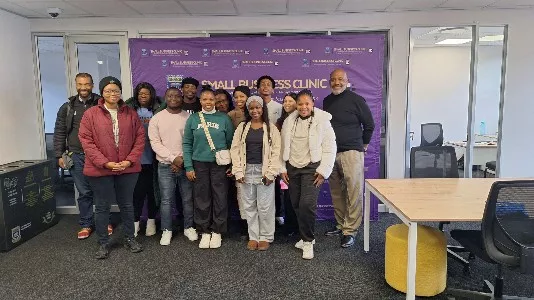 Marvin Carolina, Jr. and Dr. Jocelyn Evans with young entrepreneurs