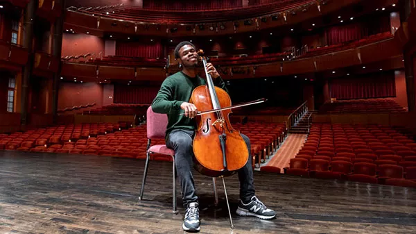 Christian Okeke with cello on stage
