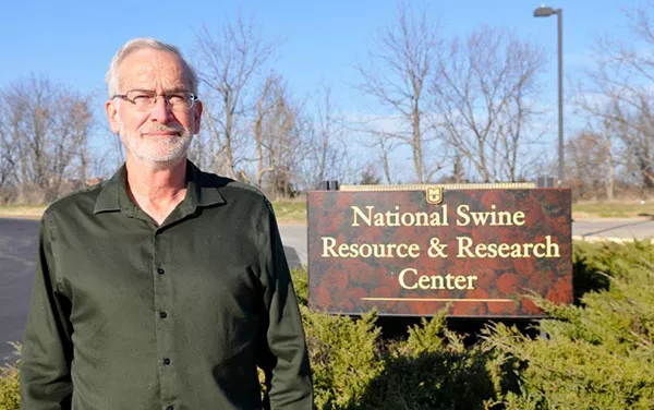 Randall Prather in front of National Swine Resouce & Research Center