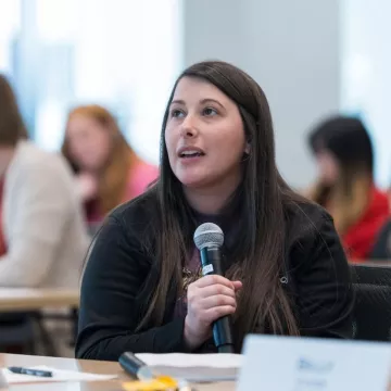 An attendee participates in Q&amp;A during a past Bootcamp