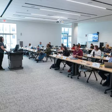 A Bootcamp in 2023 gathers in the Atkins Room at the NextGen Precision Health building