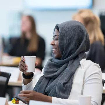An attendee at a past Bootcamp engages in a lively discussion